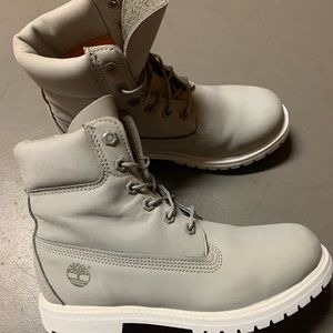 Grey and white Timberlands